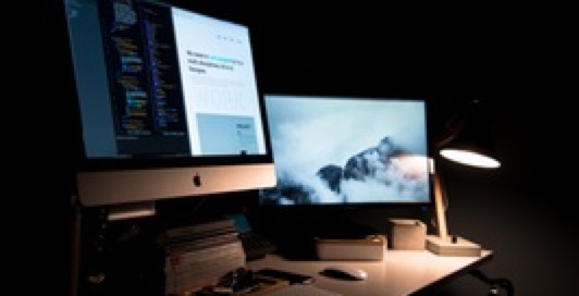 a computer with two monitors